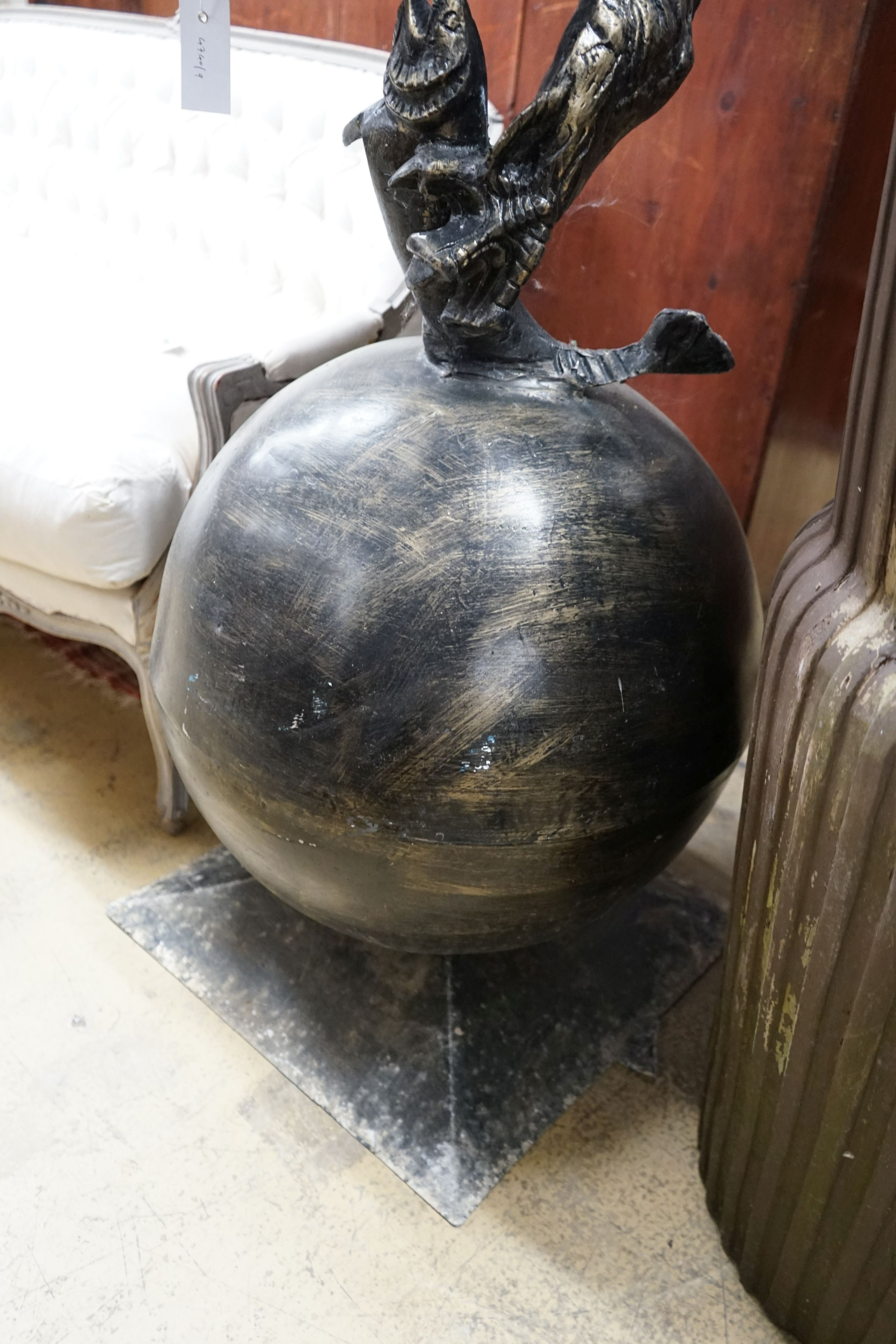 A large cast metal faux bronze eagle, salmon and orb garden ornament, height 200cm